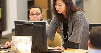 ELAC's Staff Helping Student in the Lab