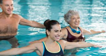 3 students of diverse ages enjoying a aquatics exercise class