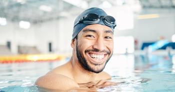 Adult Swimmer Smiling while in a Pool