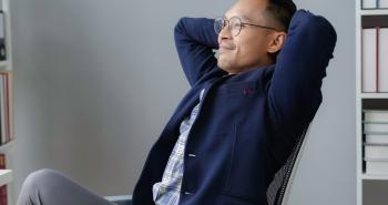 Confident and relaxed man in office 
