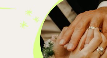 close up of hands with wedding rings