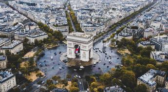 Photo of the arc in Paris with cars circling.