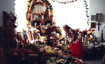 Photo of woman in front of alter.