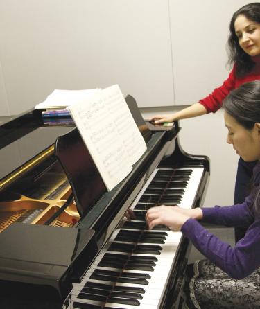 Piano Teacher with his Student