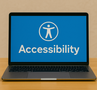 Laptop on a table displaying an accessibility icon and the word "Accessibility."