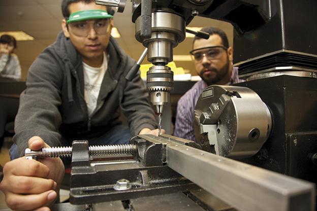 Students Performing a Metal Cutting Practice