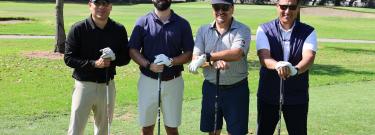 Group of golfers stand on the course during the 2025 ELAC Alumni Association Golf Tournament