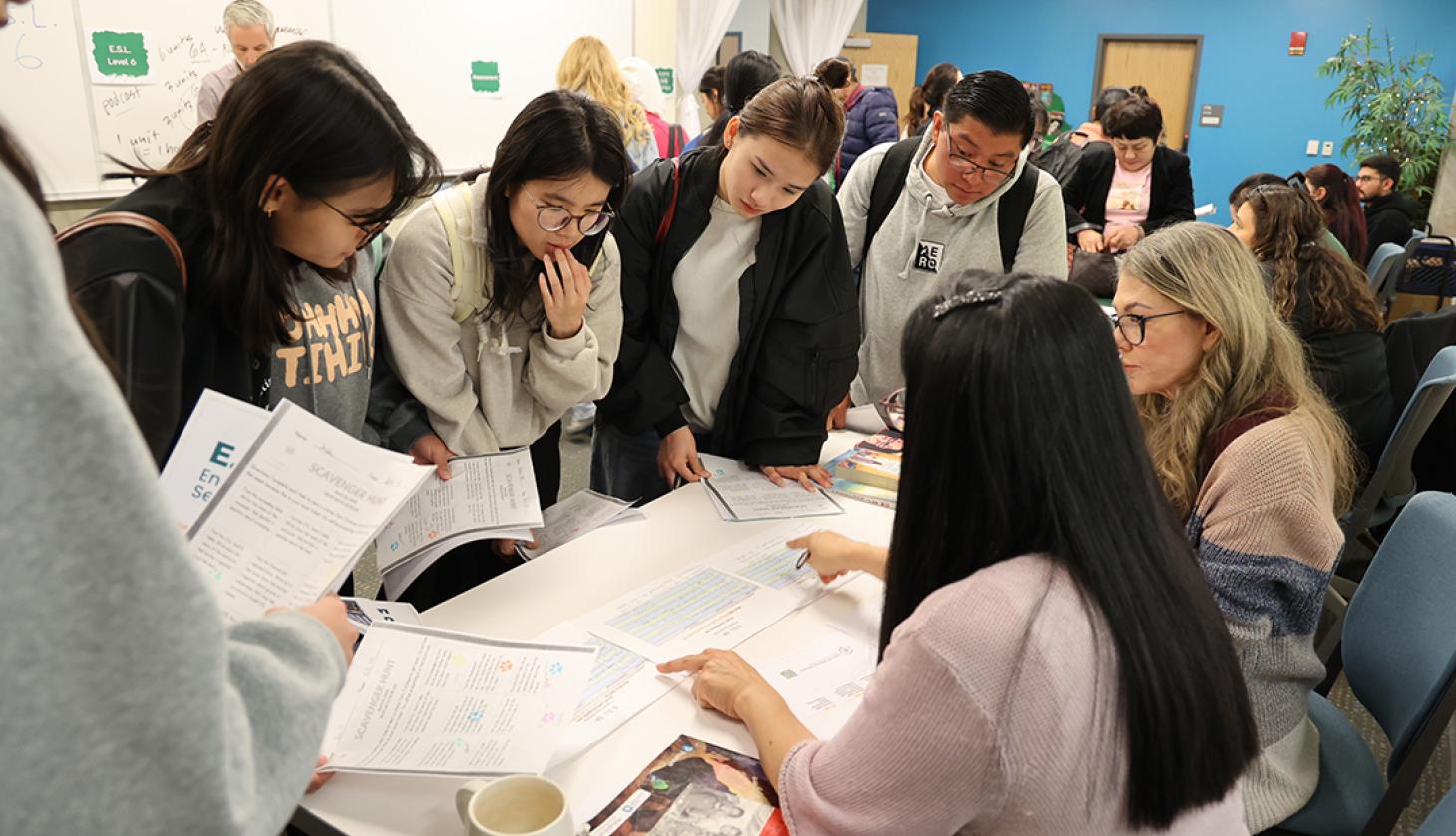 Staff sharing information with students.