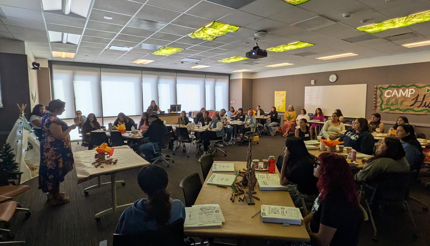 Woman speaks to a group